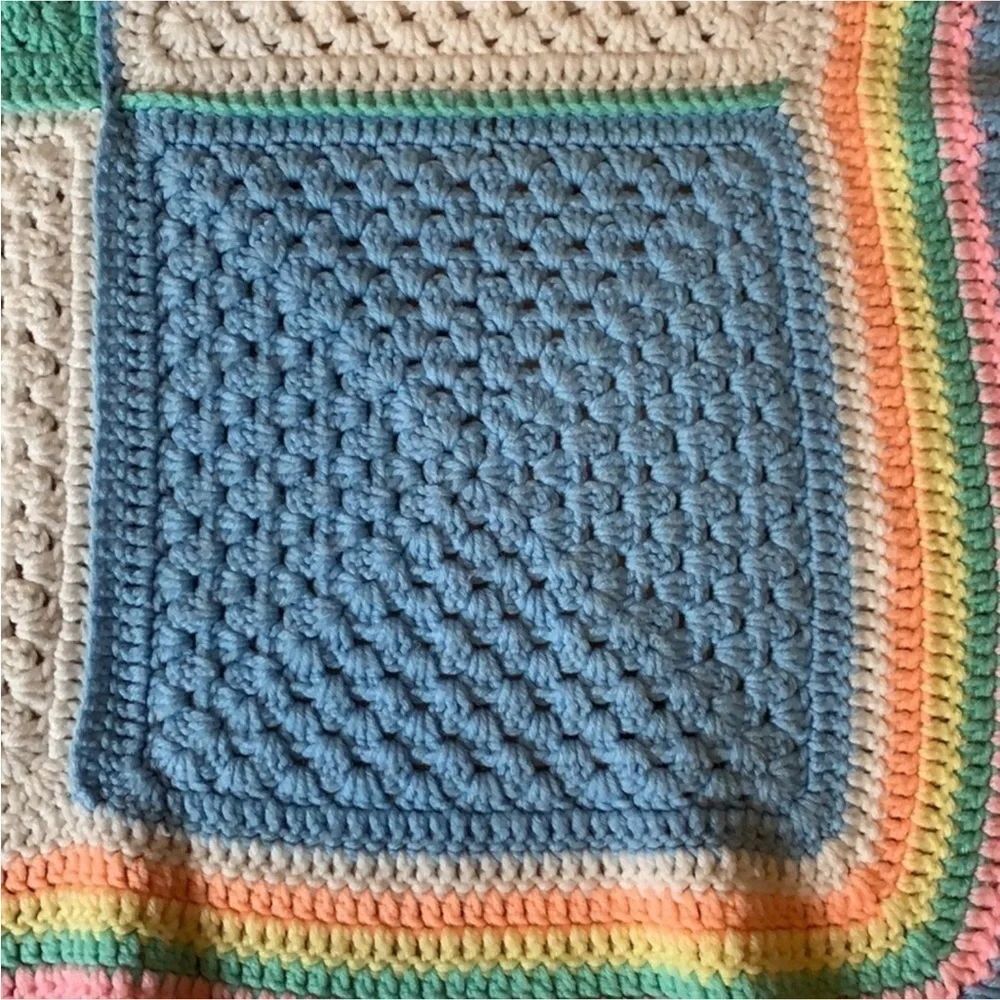 Handmade crochet baby blanket in pastel colors / colorblock pattern